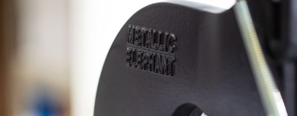 Close up of a Metallic Elephant logo on a hot foil press machine