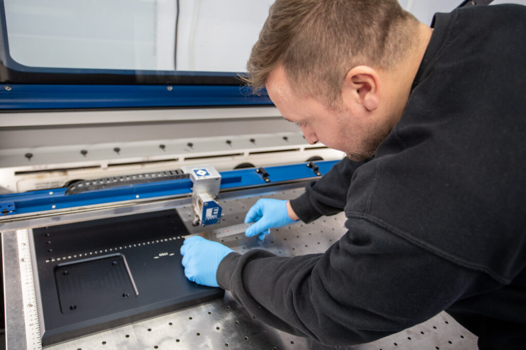 Man measuring materials ready to be cut