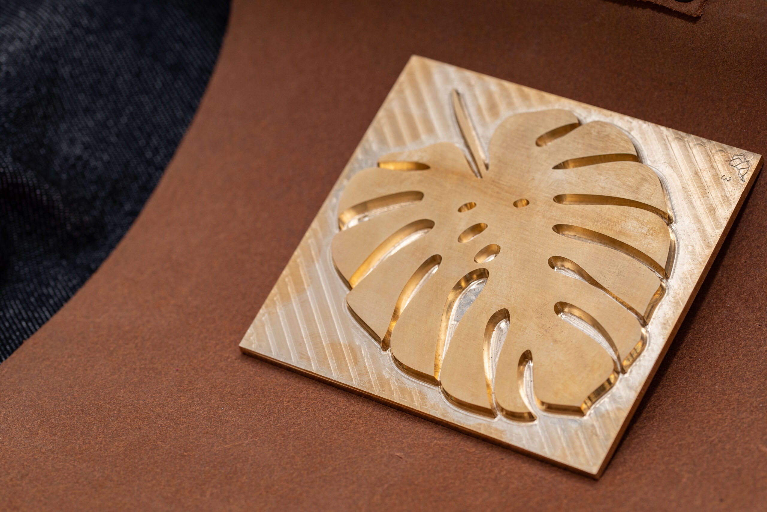 Close up of a brass plate die