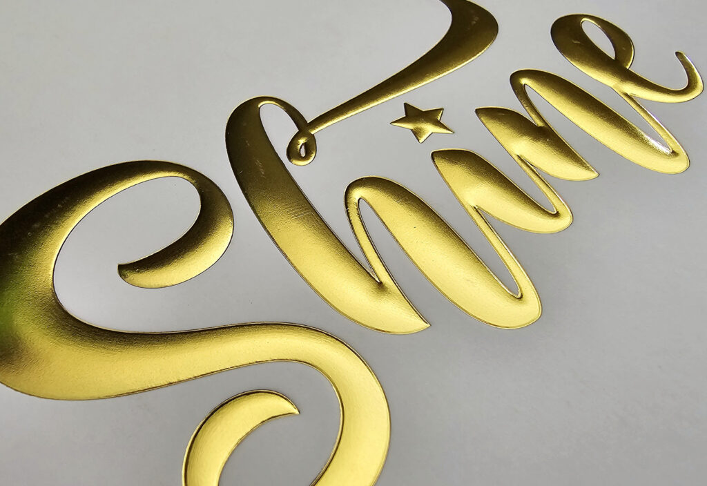 Close up of gold foiled text