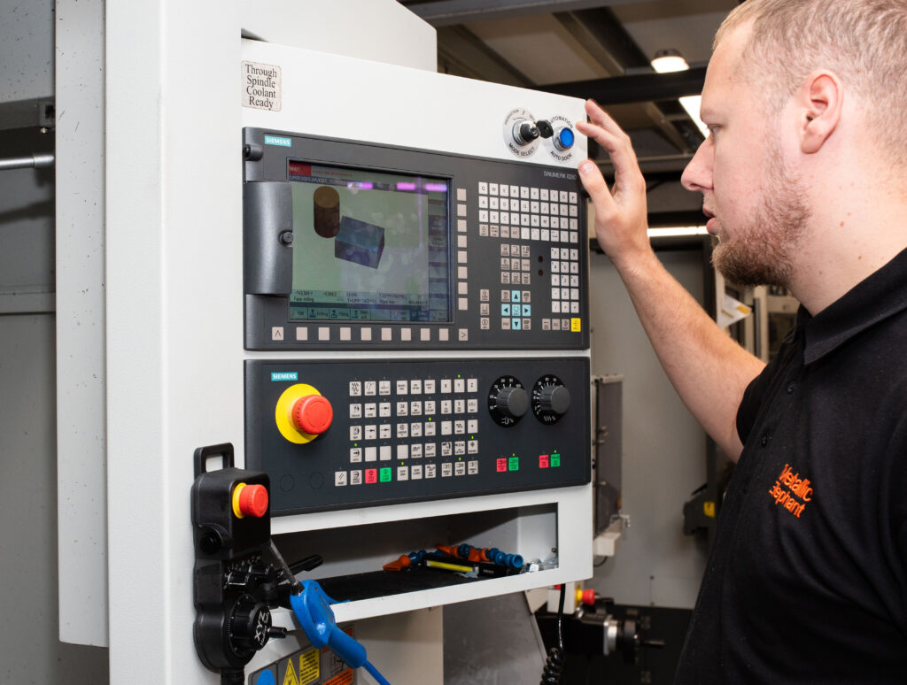 Man operating a CNC machine
