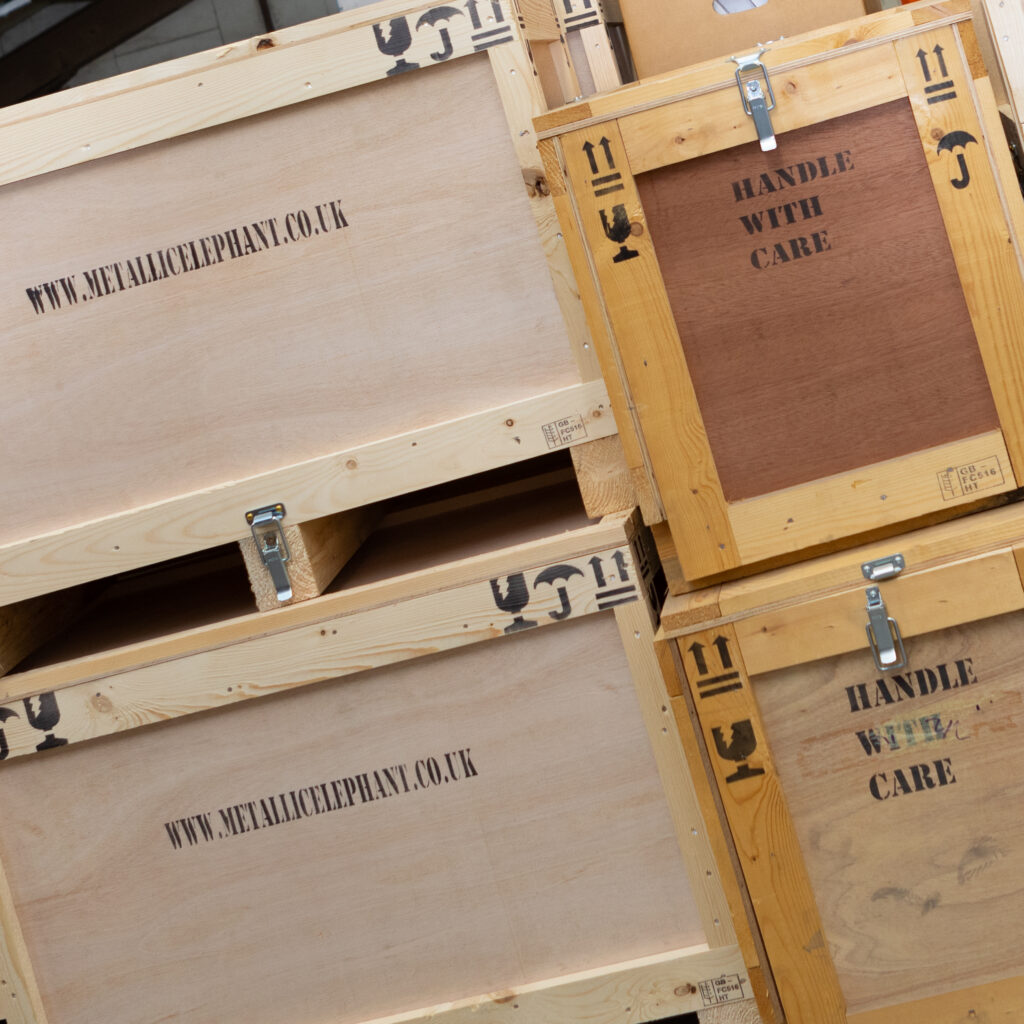 Stack of storage crates with Metallic Elephant name printed on the side