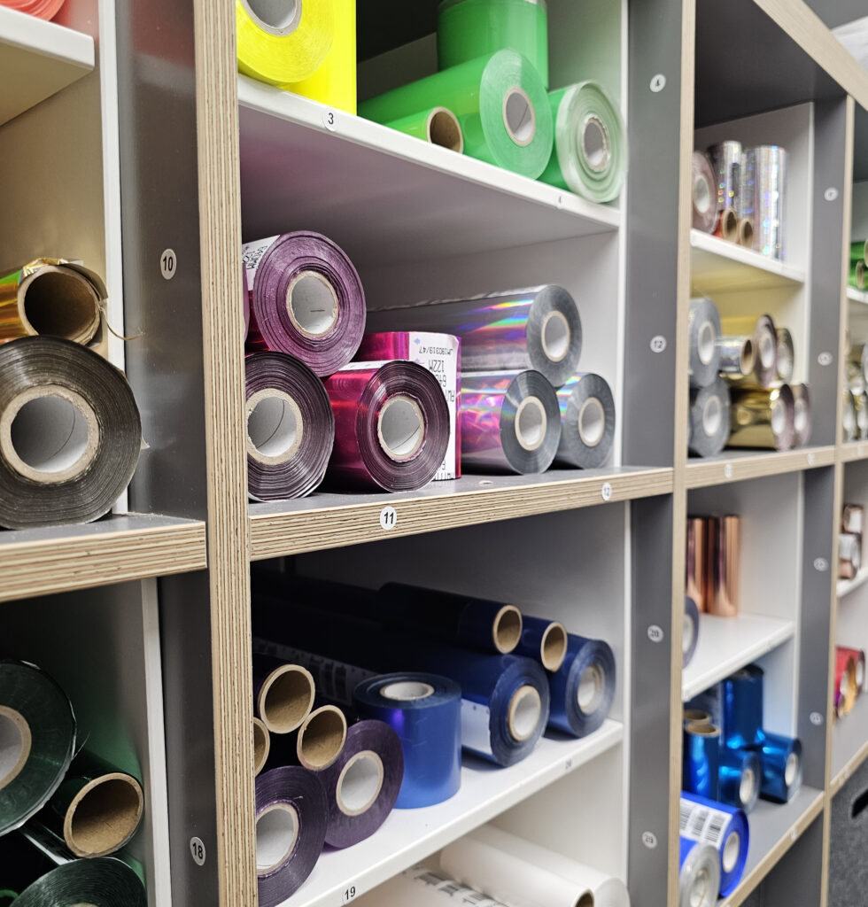 Shelf displaying different coloured foils