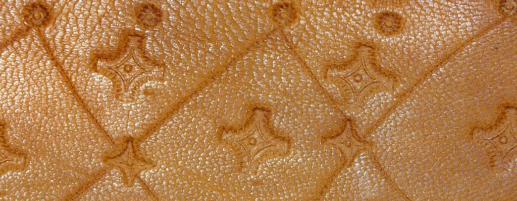 Debossed printing is a finishing method that presses parts of your design like a logo, wordmark, or pattern below the surface of the material